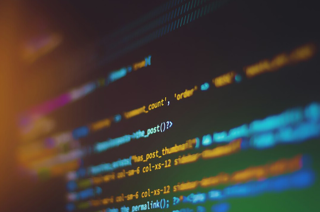 programmer writing code on screen