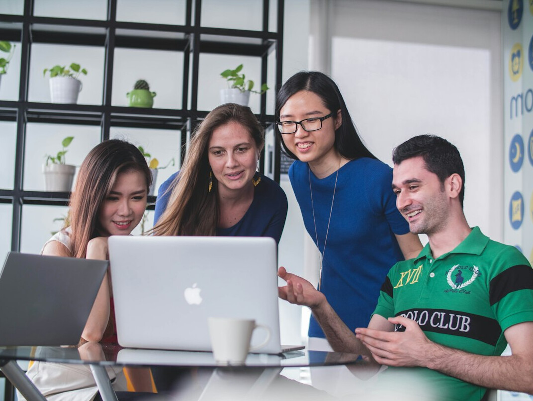 team discussing insurance tech